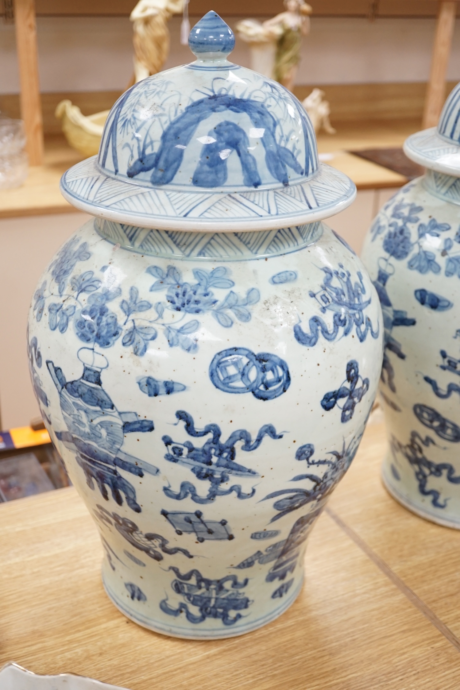 A large pair of Chinese blue and white ginger jars and covers, 54cm high. Condition - fair to good